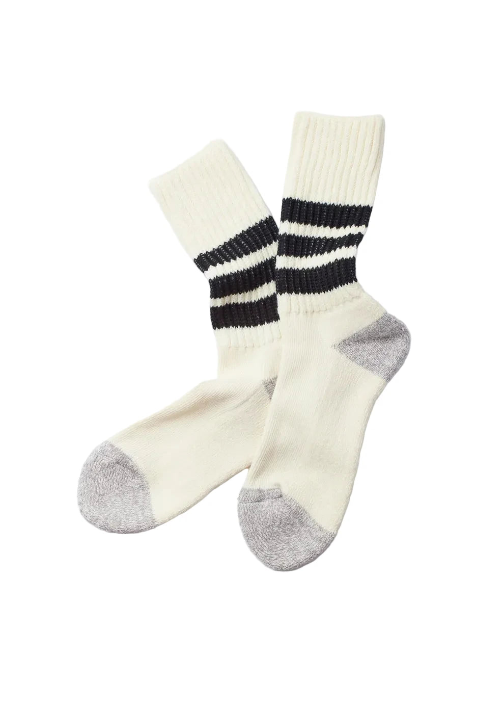 A pair of cream-colored knit socks with black and white horizontal stripes on the calf and gray toe and heel sections, displayed on a clean white background.