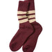 A pair of maroon crew socks with cream and maroon horizontal stripes near the ribbed cuffs, displayed on a light gray background.