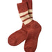 A pair of ribbed knit crew socks in a rust brown color, featuring two horizontal cream stripes near the cuff, displayed on a light gray background.