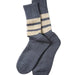 A pair of gray knit crew socks with two horizontal cream stripes near the ribbed cuffs, displayed on a light gray background.