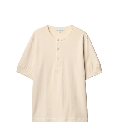 Beige short-sleeve shirt on a light gray background