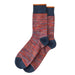 Pair of red and blue striped socks on a white background