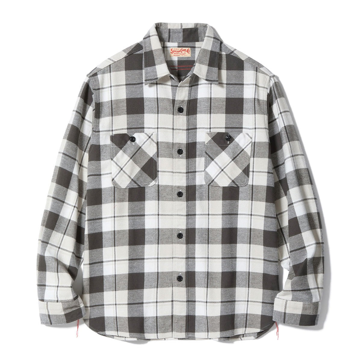 Black and white checkered shirt with brand logo on a white background