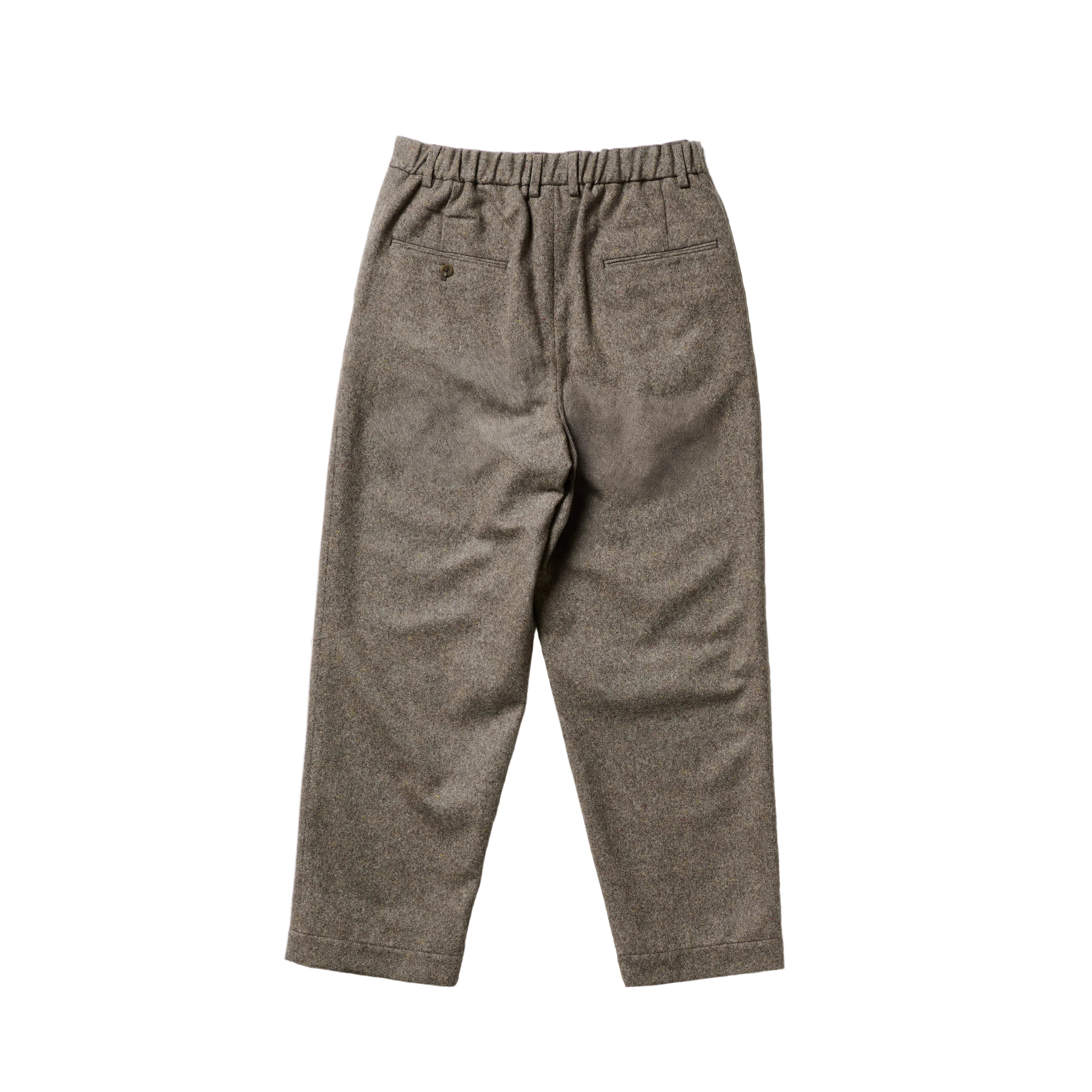 A pair of brown tweed trousers with an elastic waistband, laid flat against a clean white background.