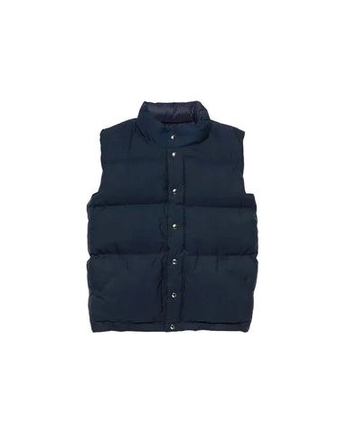 Navy puffer vest on a light gray background