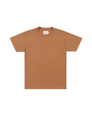 A plain short-sleeve crewneck t-shirt in a warm camel brown color, laid flat against a light gray background.