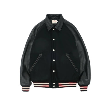 Black varsity jacket with leather sleeves on a light gray background
