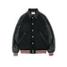 Black varsity jacket with leather sleeves on a light gray background