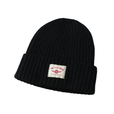 Black beanie with a label on a gray background