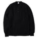 Black long-sleeve shirt on a gray background
