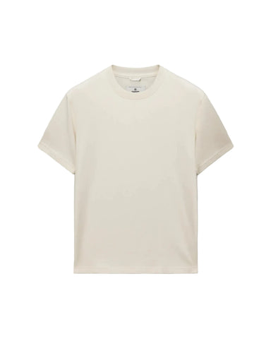 A plain cream-colored short-sleeve crewneck t-shirt, photographed flat against a light gray background.