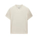 A plain cream-colored short-sleeve crewneck t-shirt, photographed flat against a light gray background.