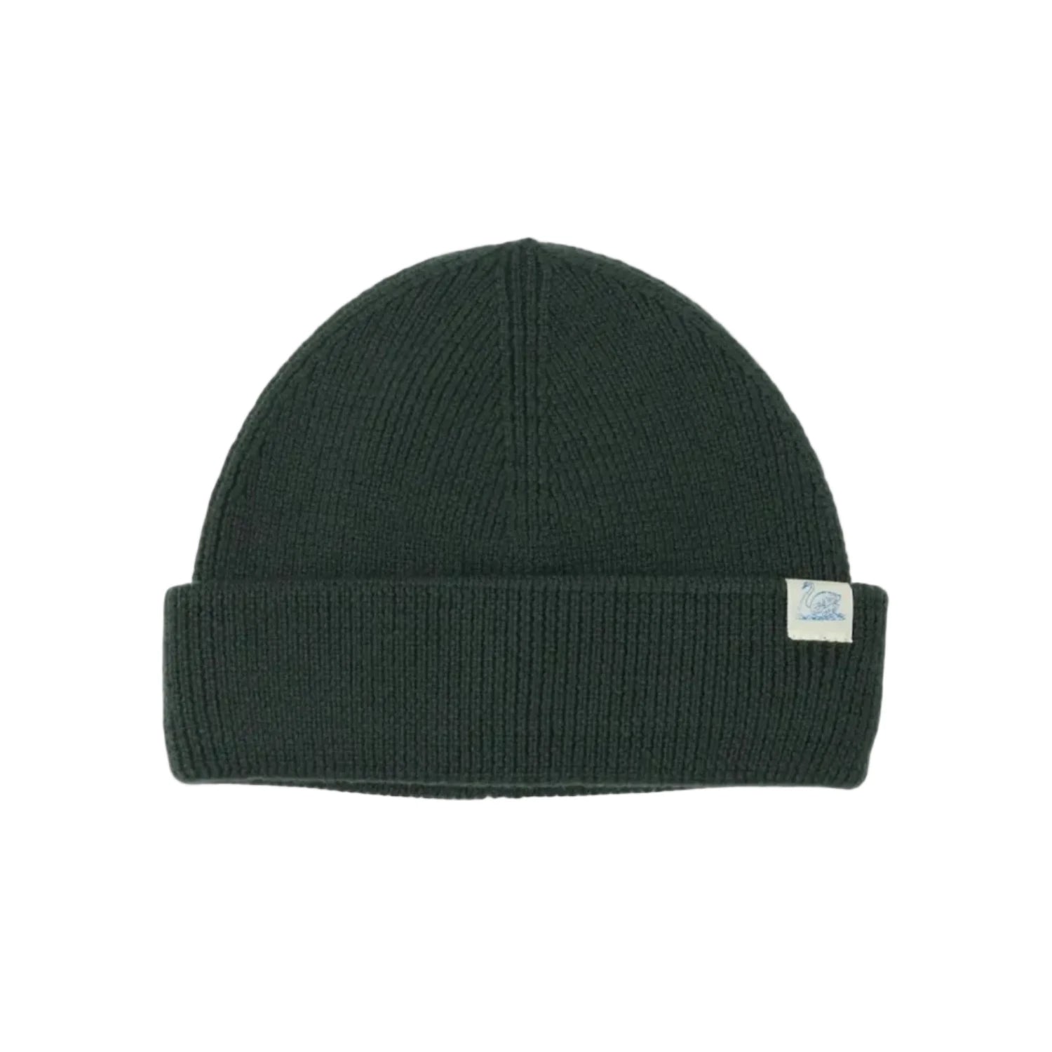 A dark forest green ribbed knit beanie hat with a folded cuff and a small white brand tag on the side, shown against a plain white background.