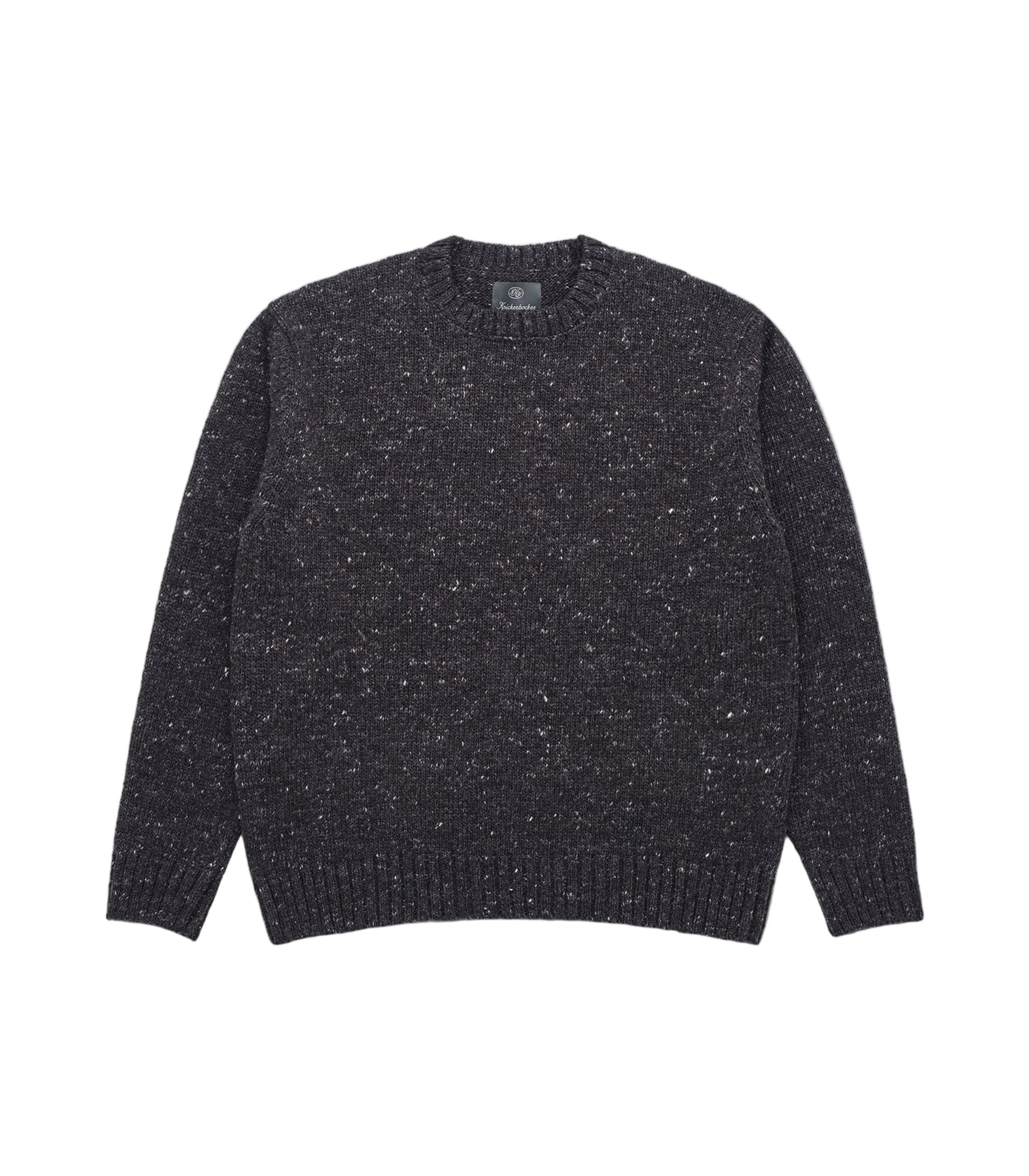 A dark charcoal gray knit crewneck sweater with subtle white and light gray flecks throughout, presented flat against a light gray background.