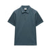 Teal polo shirt on a light gray background