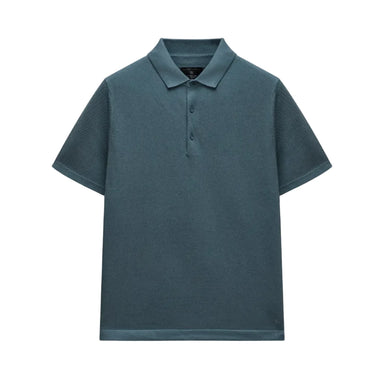 Blue polo shirt on a light gray background