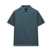 Blue polo shirt on a light gray background