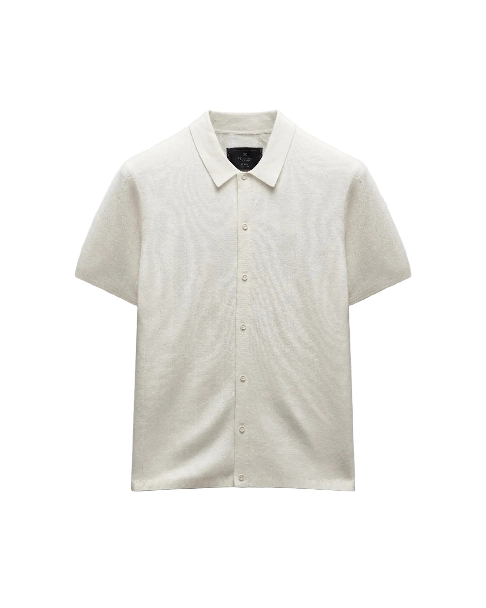 Beige short-sleeve shirt on a light gray background