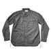 A dark gray, long-sleeve button-up shirt with a chest pocket, laid flat against a light gray background.