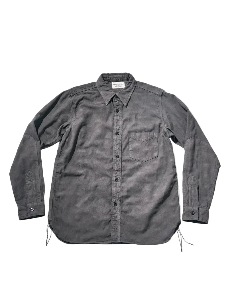 A dark gray, long-sleeve button-up shirt with a chest pocket, laid flat against a light gray background.