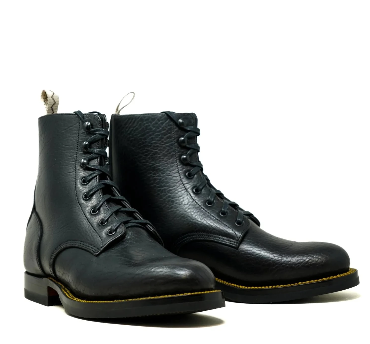 Pair of black leather boots on a white background