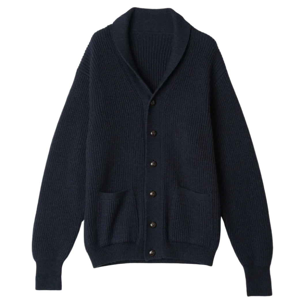 Navy blue cardigan with button details on a beige background