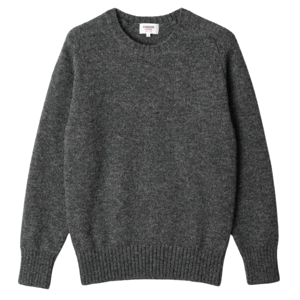 Gray sweater on a beige background