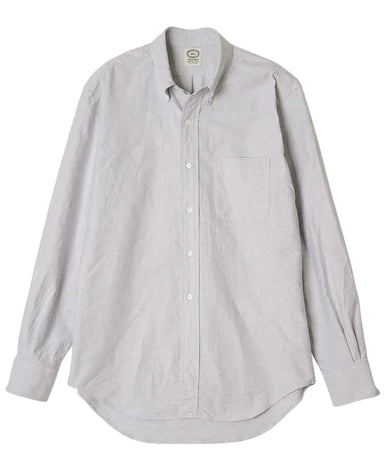 Light gray button-up shirt on a beige background
