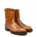 Pair of brown leather boots on a white background