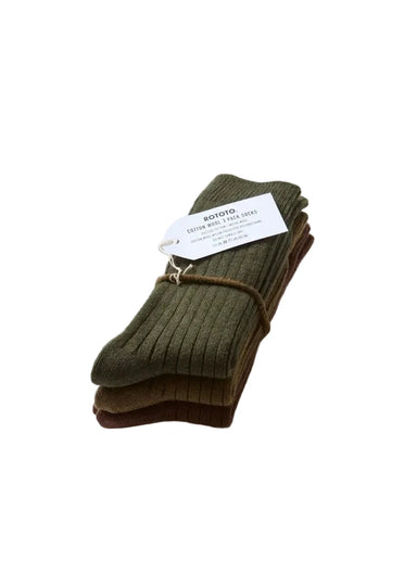 A stack of four ribbed knit socks in olive green, brown, and dark brown, tied with a white paper tag that reads 'BOTOTO' and '4 Pairs of Ribbed Socks', on a clean white background.